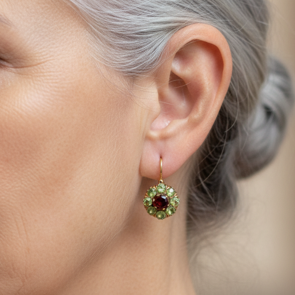 Gold-tone drop earrings with green clusters and red centre stones