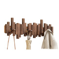 Wall-mounted ribbed coat rack with folding hooks