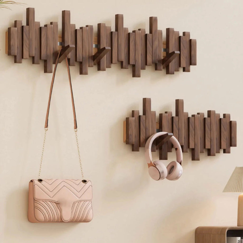 Wall-mounted ribbed coat rack with folding hooks