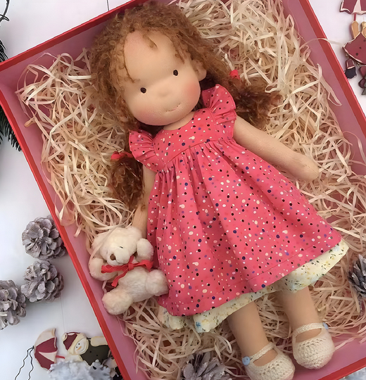 Handmade soft Waldorf-style doll with yarn hair and detailed outfit