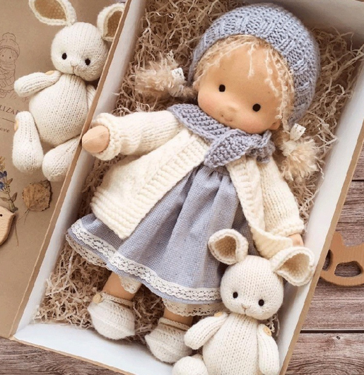 Handmade soft Waldorf-style doll with yarn hair and detailed outfit