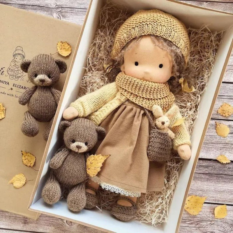Handmade soft Waldorf-style doll with yarn hair and detailed outfit