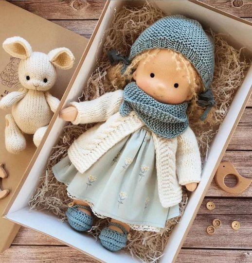 Handmade soft Waldorf-style doll with yarn hair and detailed outfit