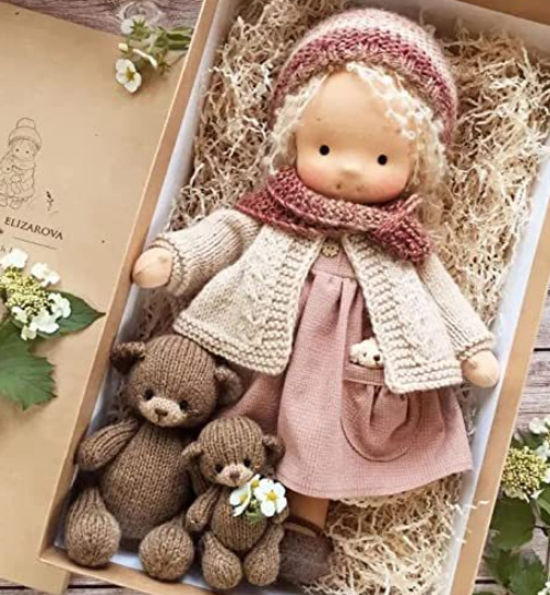 Handmade soft Waldorf-style doll with yarn hair and detailed outfit