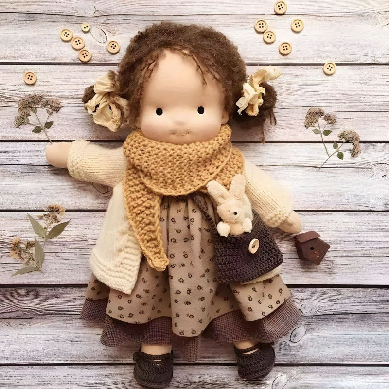 Handmade soft Waldorf-style doll with yarn hair and detailed outfit