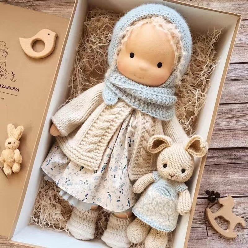 Handmade soft Waldorf-style doll with yarn hair and detailed outfit