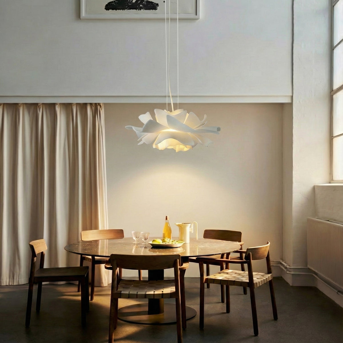 White floral pendant light with layered petal shade and hanging cord