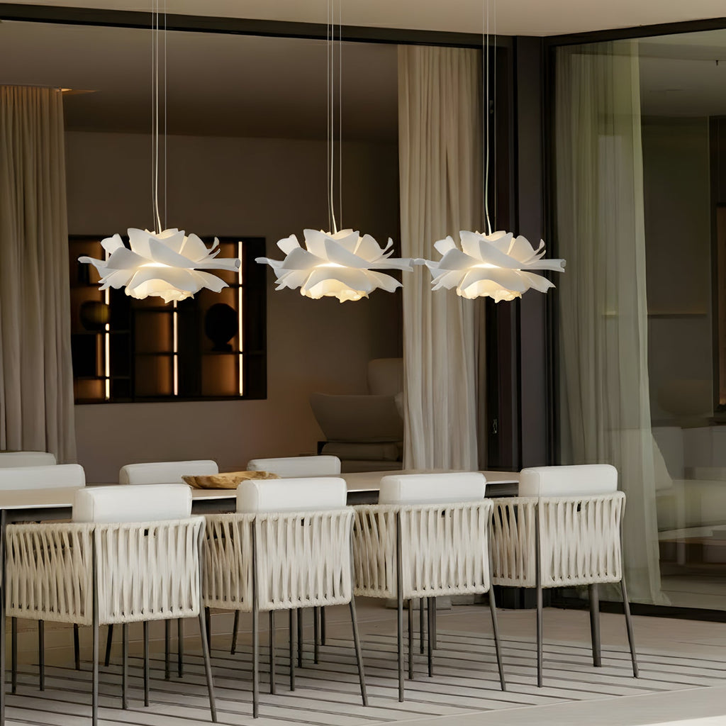 White floral pendant light with layered petal shade and hanging cord