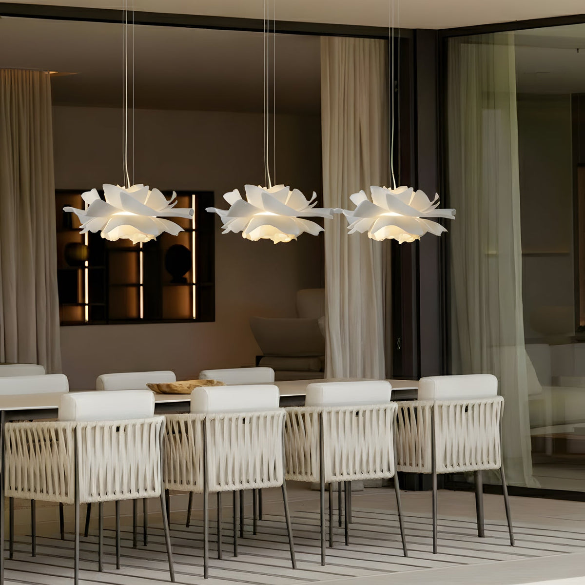 White floral pendant light with layered petal shade and hanging cord