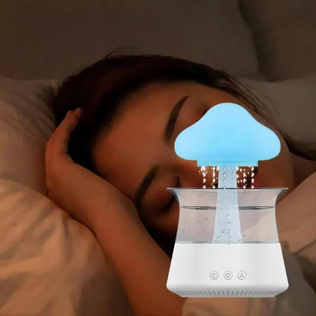 Cloud-shaped humidifier with transparent reservoir and decorative water feature