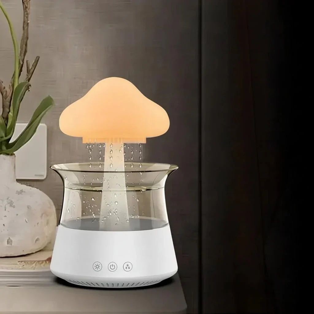 Cloud-shaped humidifier with transparent reservoir and decorative water feature