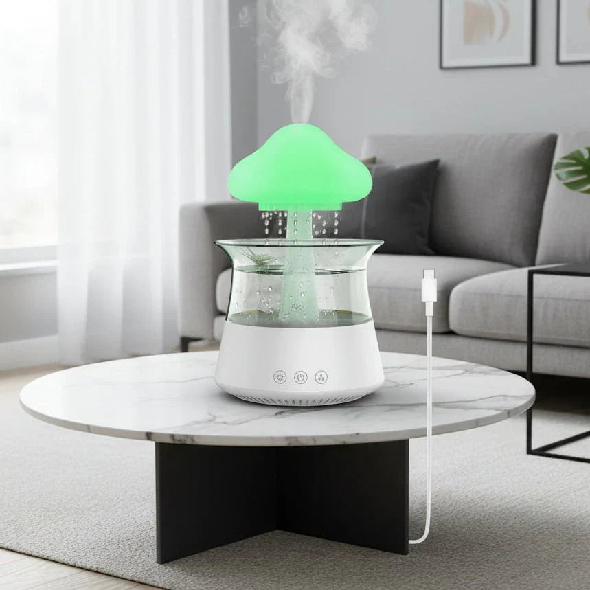 Cloud-shaped humidifier with transparent reservoir and decorative water feature