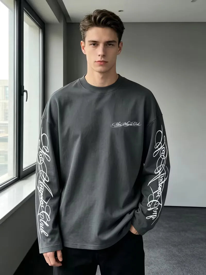 Long sleeve crew neck top with contrasting graphic prints on the sleeves