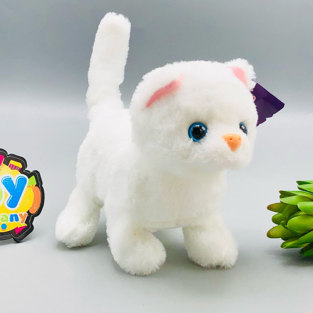 Walking plush cat toy with sound in white and orange striped designs
