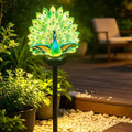 Green illuminated peacock solar garden light with feather display and ground stake