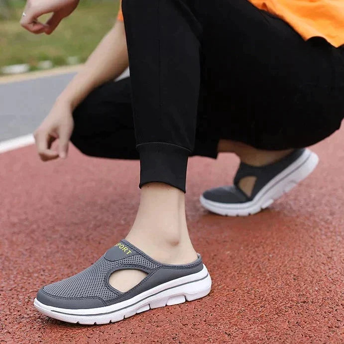Backless slip-on flats with mesh-textured upper, side cutouts and thick textured sole