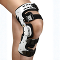 White and black hinged knee brace with adjustable straps