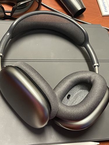 Over-ear noise cancelling headphones with padded ear cups and headband
