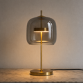 Table lamp with rounded tinted glass shade, central stem and circular base