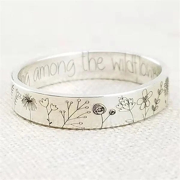 Silver-tone ring with engraved wildflower and botanical designs