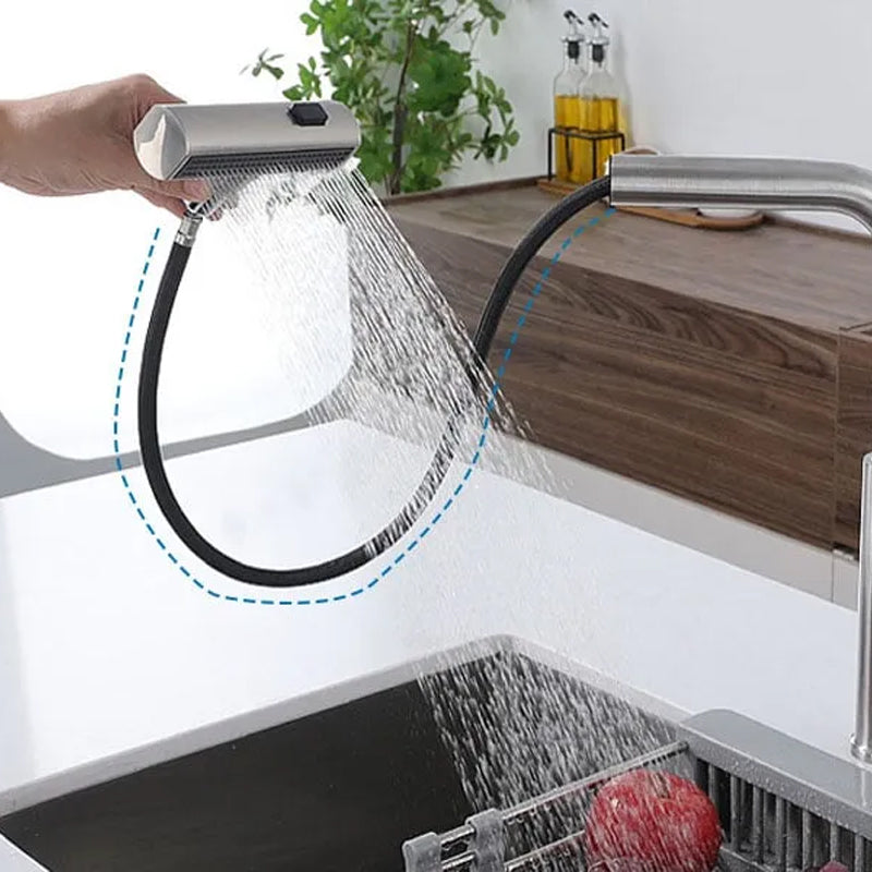 Chrome kitchen faucet attachment with flexible spray head over a sink