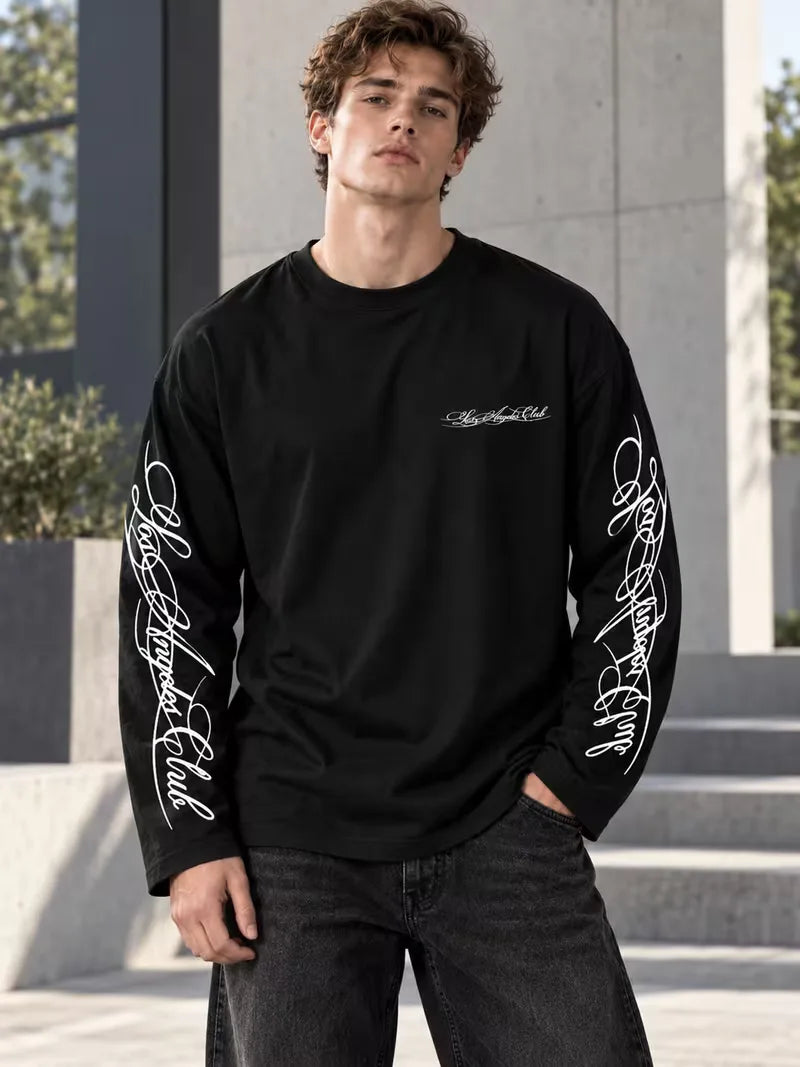 Long sleeve crew neck top with contrasting graphic prints on the sleeves