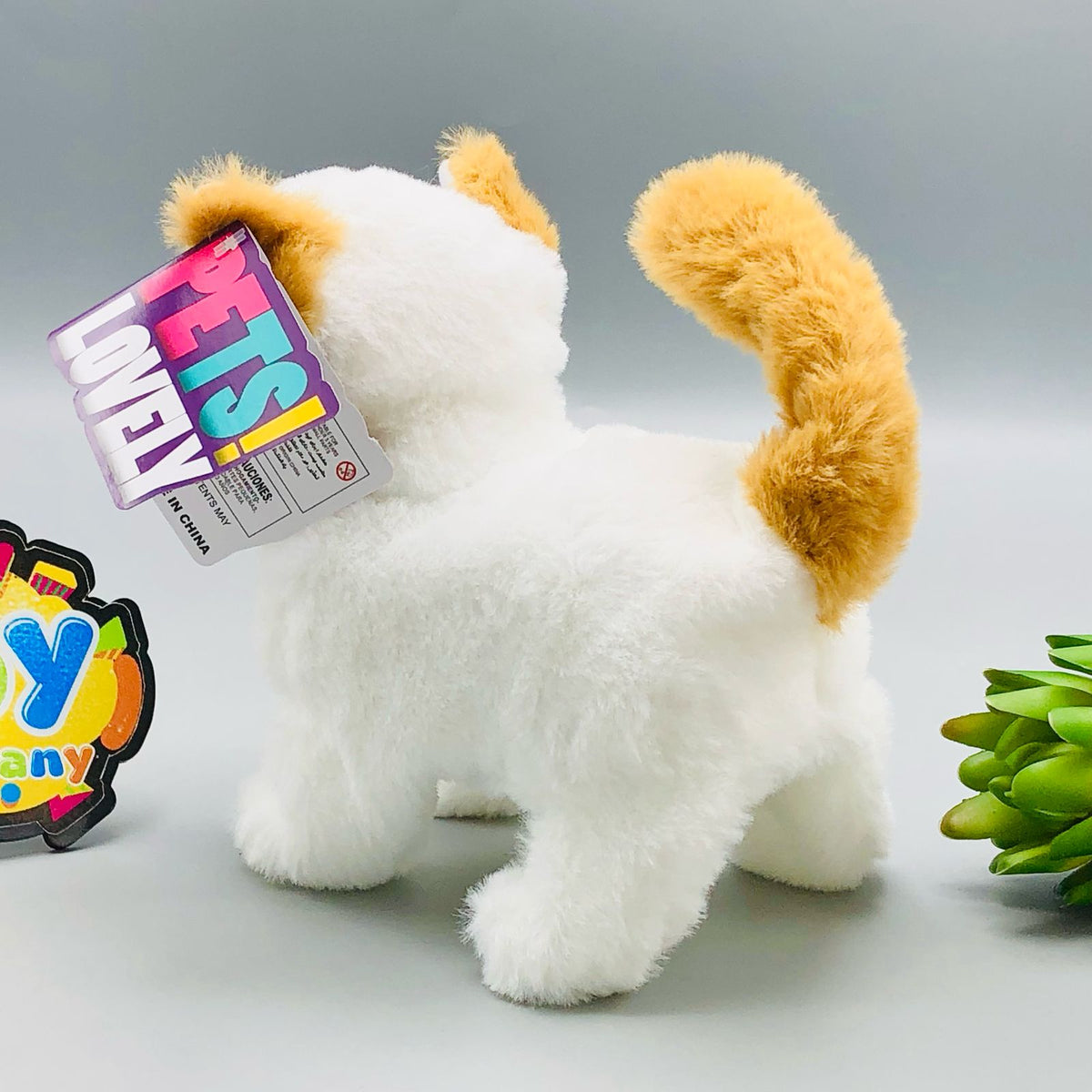 Walking plush cat toy with sound in white and orange striped designs