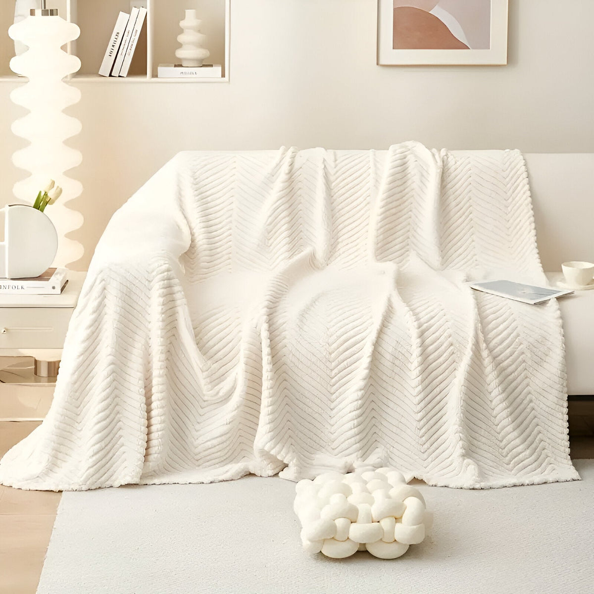 Geometric textured sofa cover draped over a living room sofa