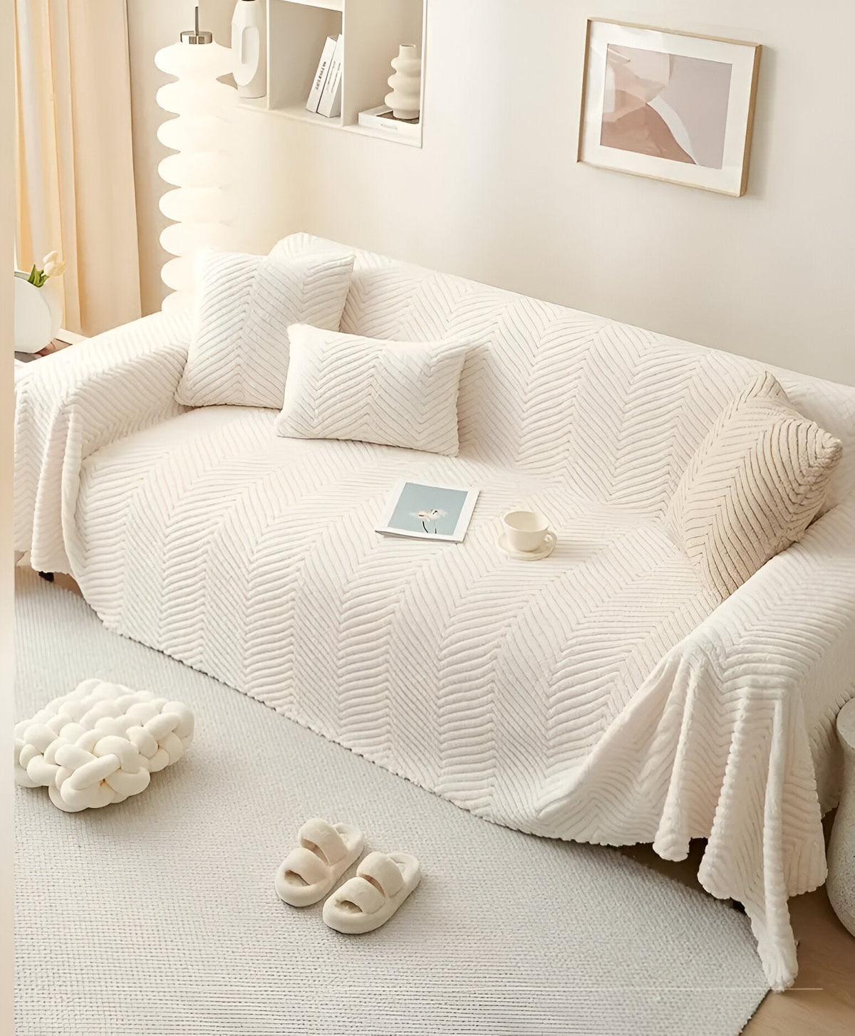 Geometric textured sofa cover draped over a living room sofa