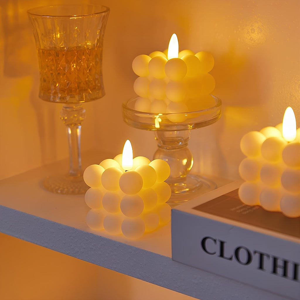 White flameless LED candle with a warm flickering flame-style light