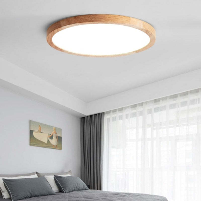 Round slim ceiling light with a natural wood-effect ring and white diffuser