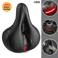 Ergonomic bicycle saddle with textured support panels, ventilation zone and suspension springs