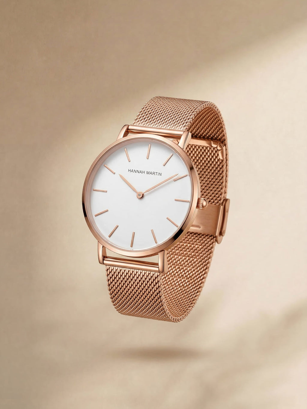 Analogue wristwatch with minimal round dial and textured mesh strap