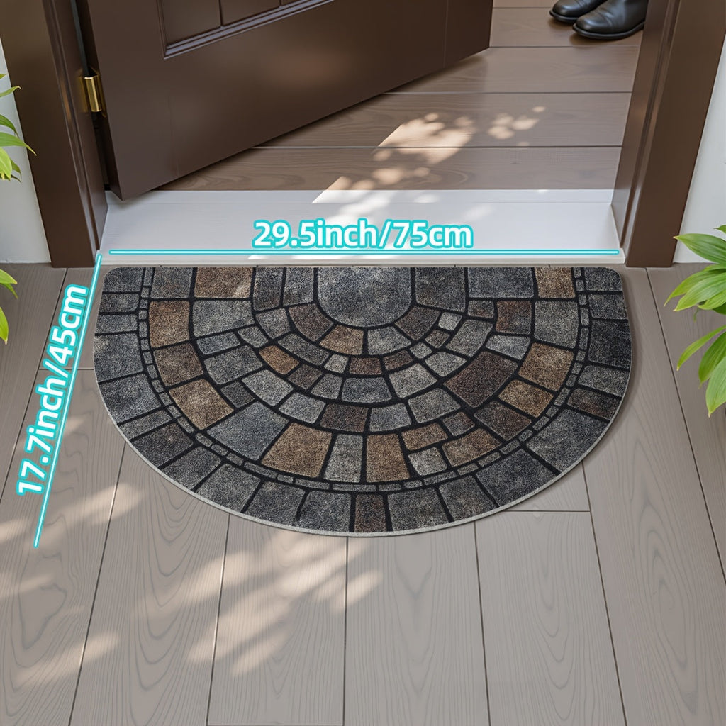 Half-circle gray geometric mosaic door mat at an entryway