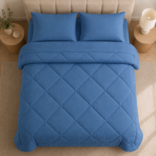 Quilted 2-in-1 duvet with diamond stitching on a bed