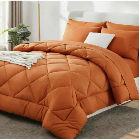 Quilted 2-in-1 duvet with diamond stitching on a bed