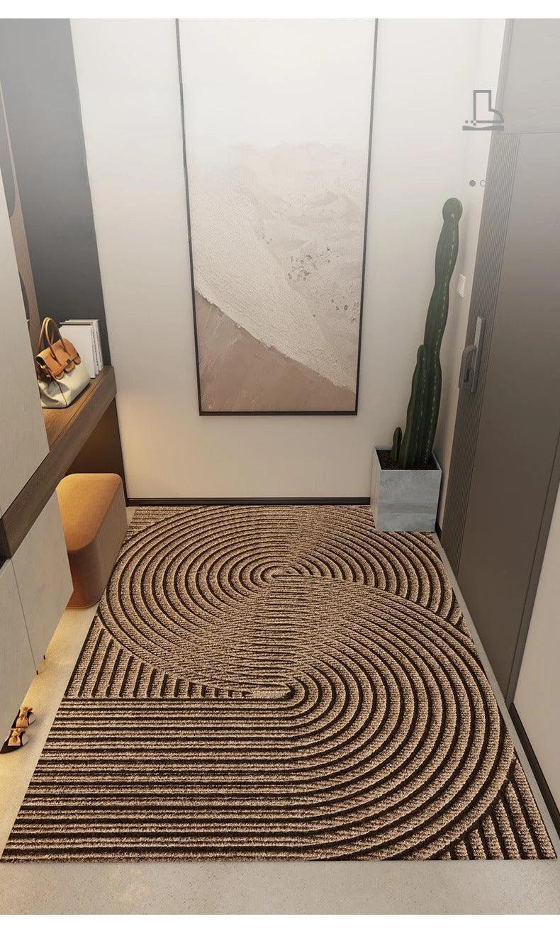 Rectangular ribbed geometric door mat in an indoor entryway