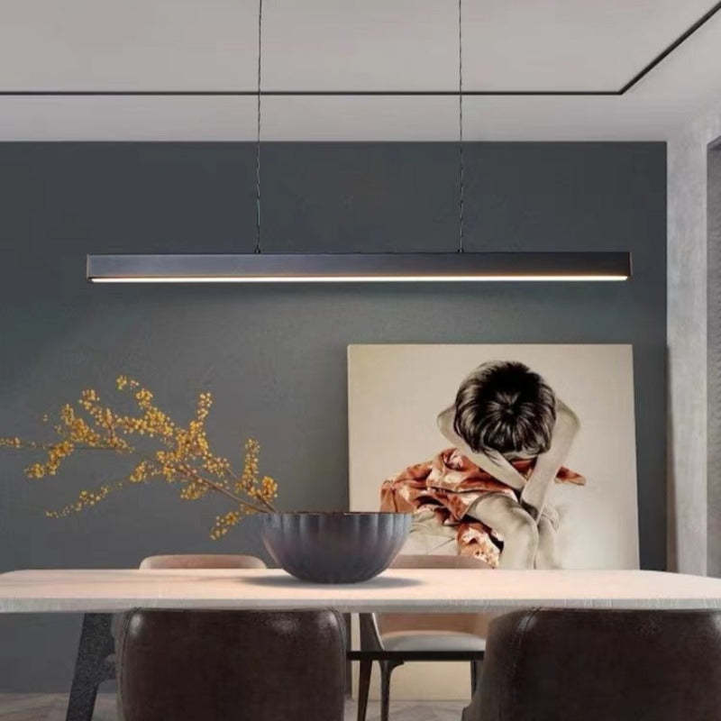 Linear LED pendant light with slim metal bar and suspension wires