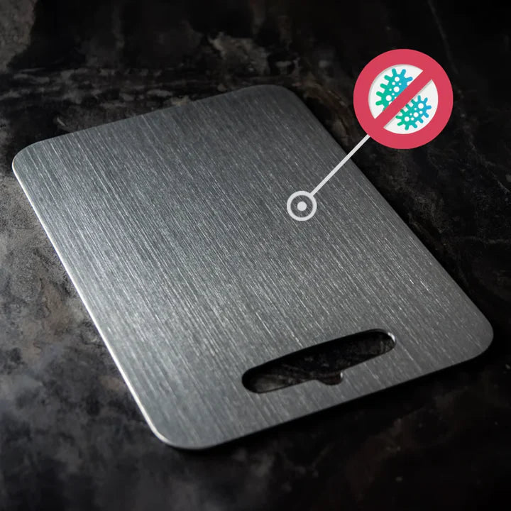 Silver titanium cutting board with brushed surface and integrated handle opening