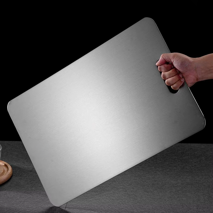 Silver titanium cutting board with brushed surface and integrated handle opening