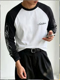 Black and white long sleeve colour block shirt with graphic sleeve prints