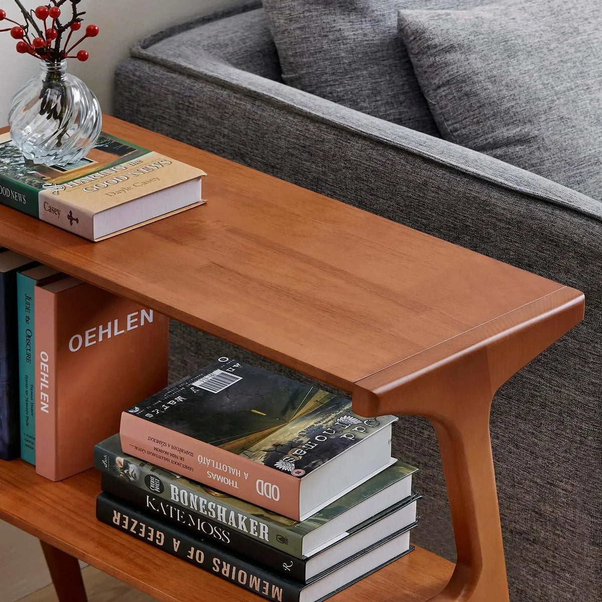 Brown two-tier wooden side table with an open lower shelf