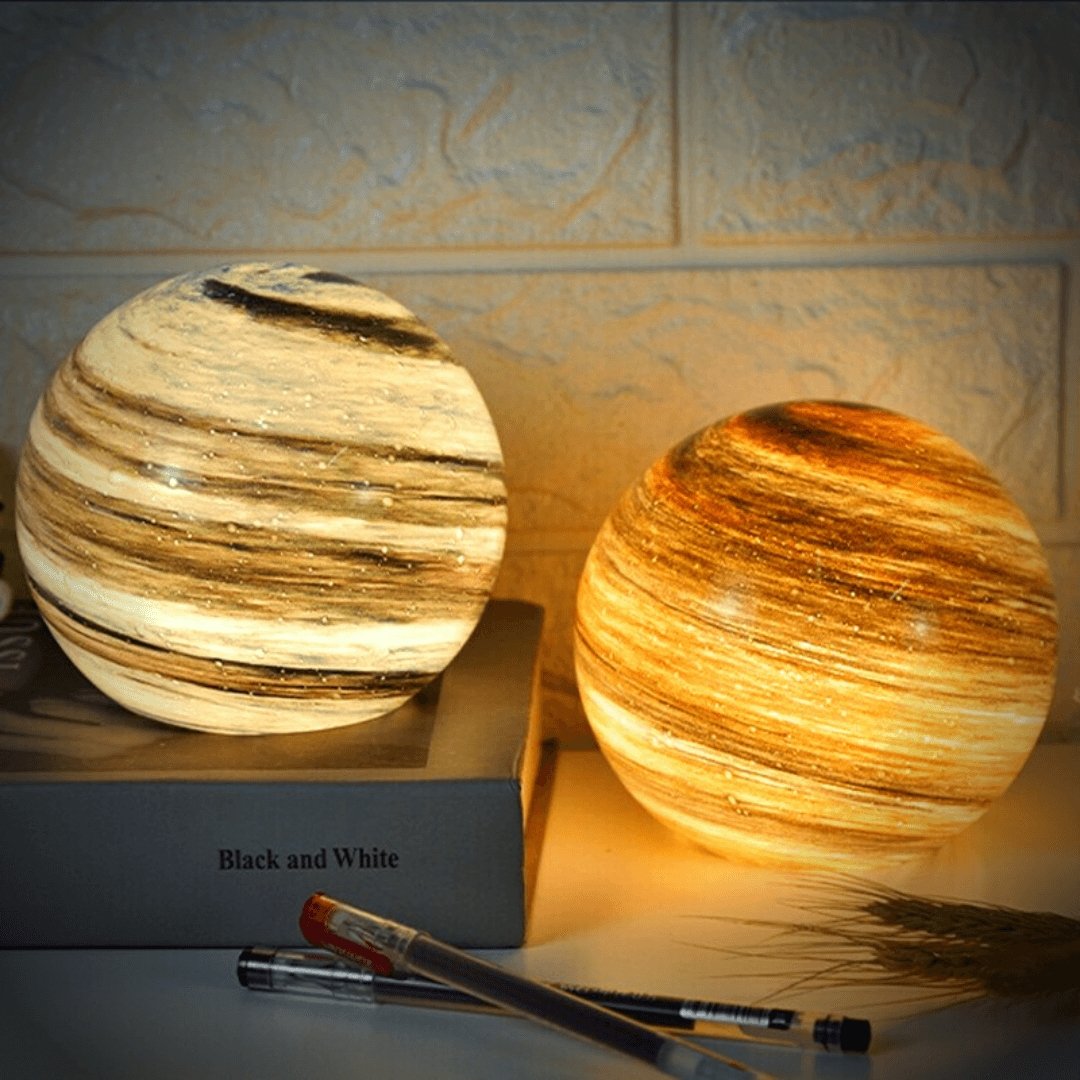 Spherical glass moon table lamp with swirling cosmic detailing