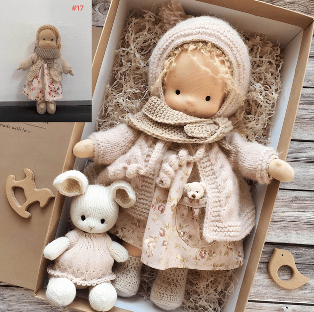 Dressed Waldorf-style doll with knitted clothing and character accessories