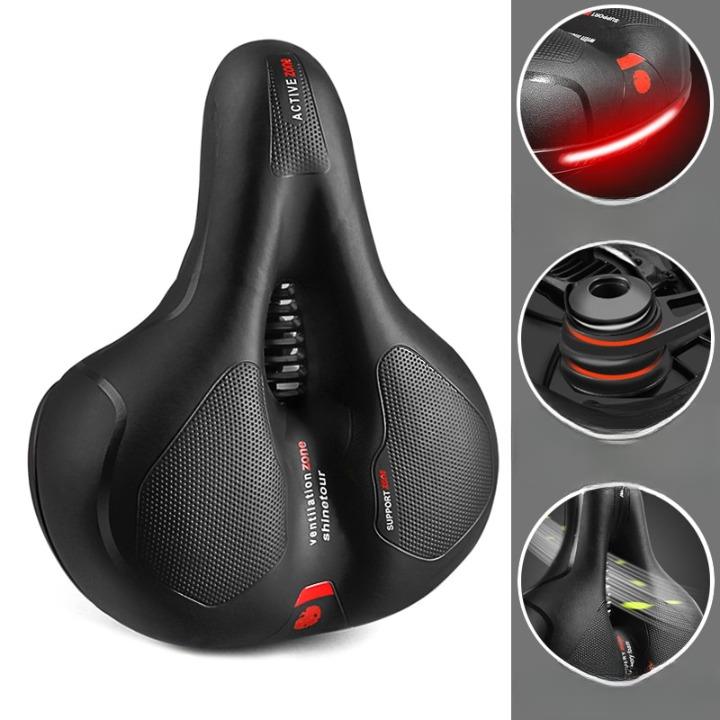 Ergonomic bicycle saddle with textured support panels, ventilation zone and suspension springs