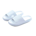 Pair of open-toe slide sandals with ribbed straps and textured soles