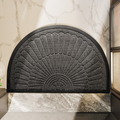 Semi-circular textured rubber door mat with raised fan pattern