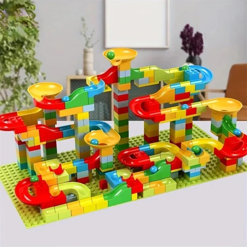 Colourful marble run construction set with interlocking blocks, ramps and tracks