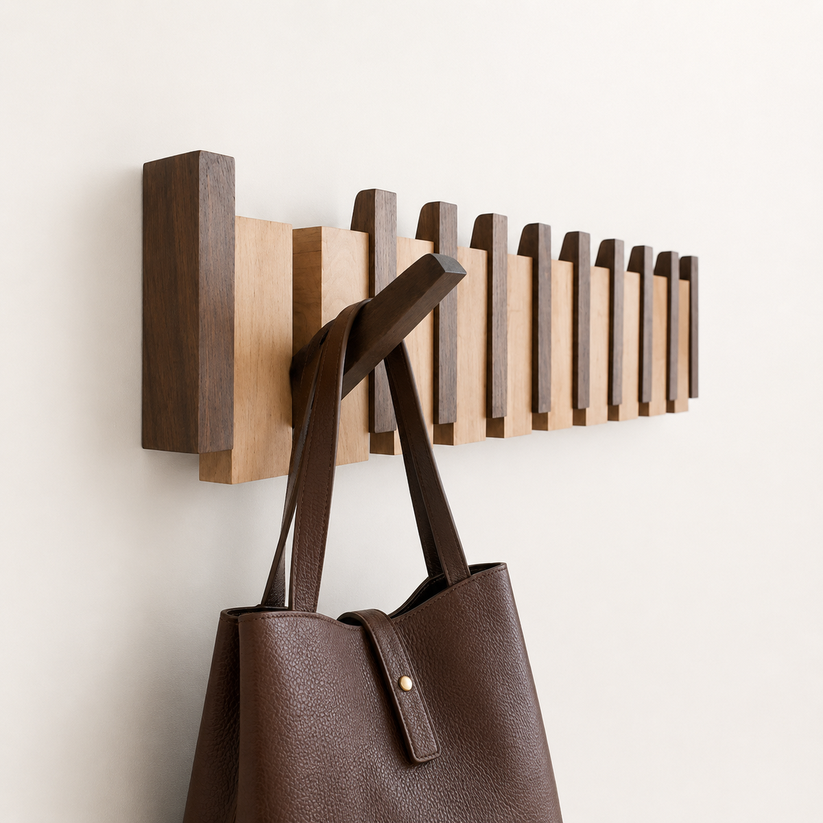 Wooden wall-mounted coat rack with alternating brown slats