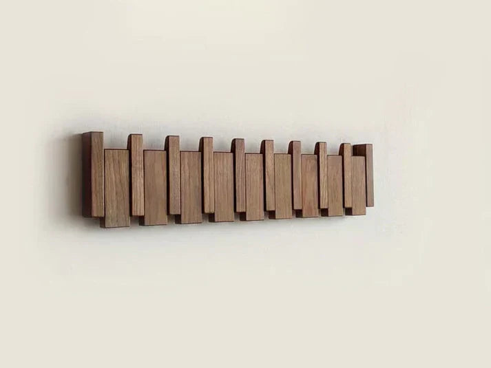 Wooden wall-mounted coat rack with alternating brown slats
